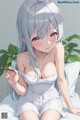 Anime girl with long gray hair sitting on a bed.